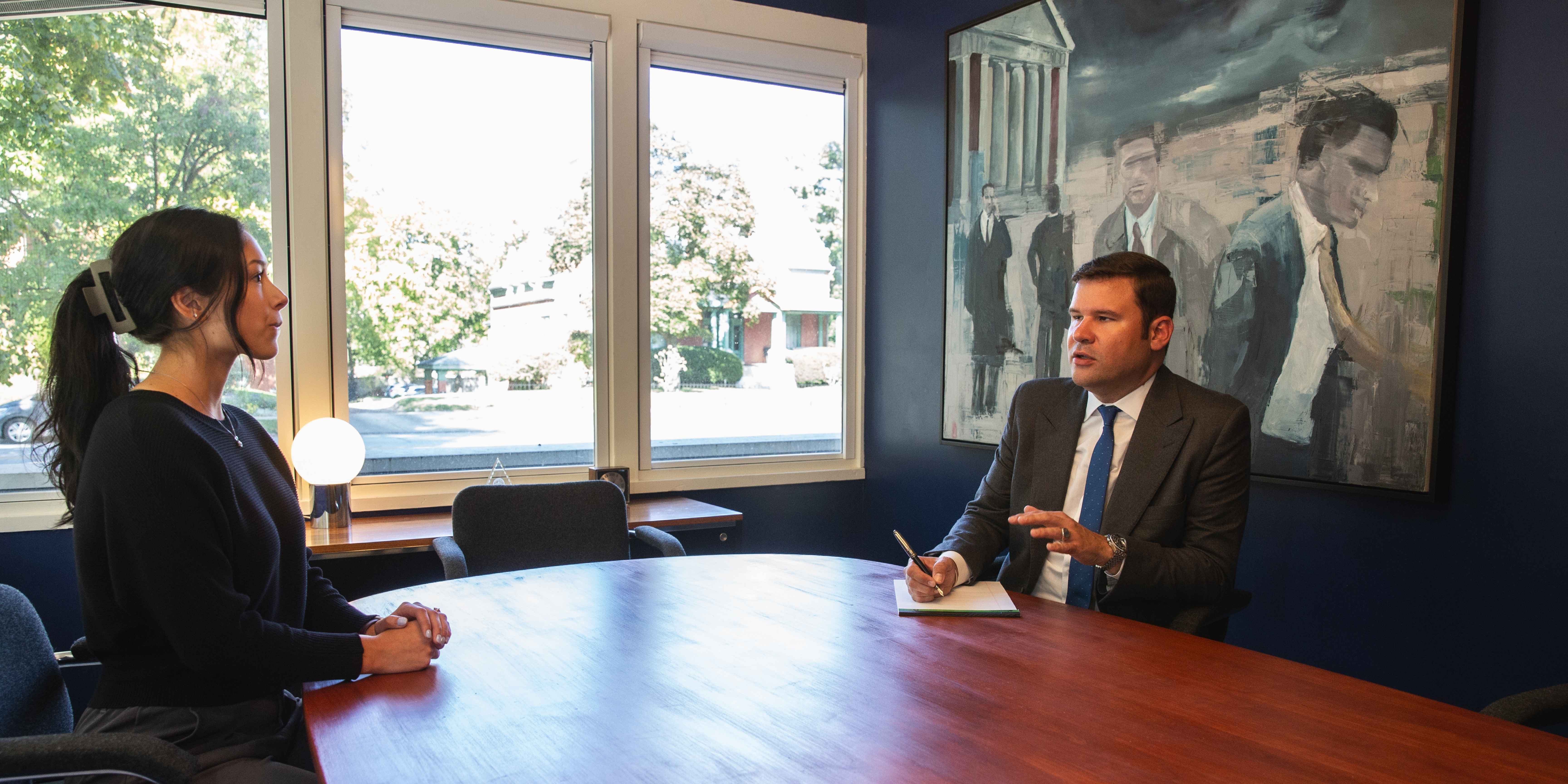 Jones and Saya in conference room Oct 2025