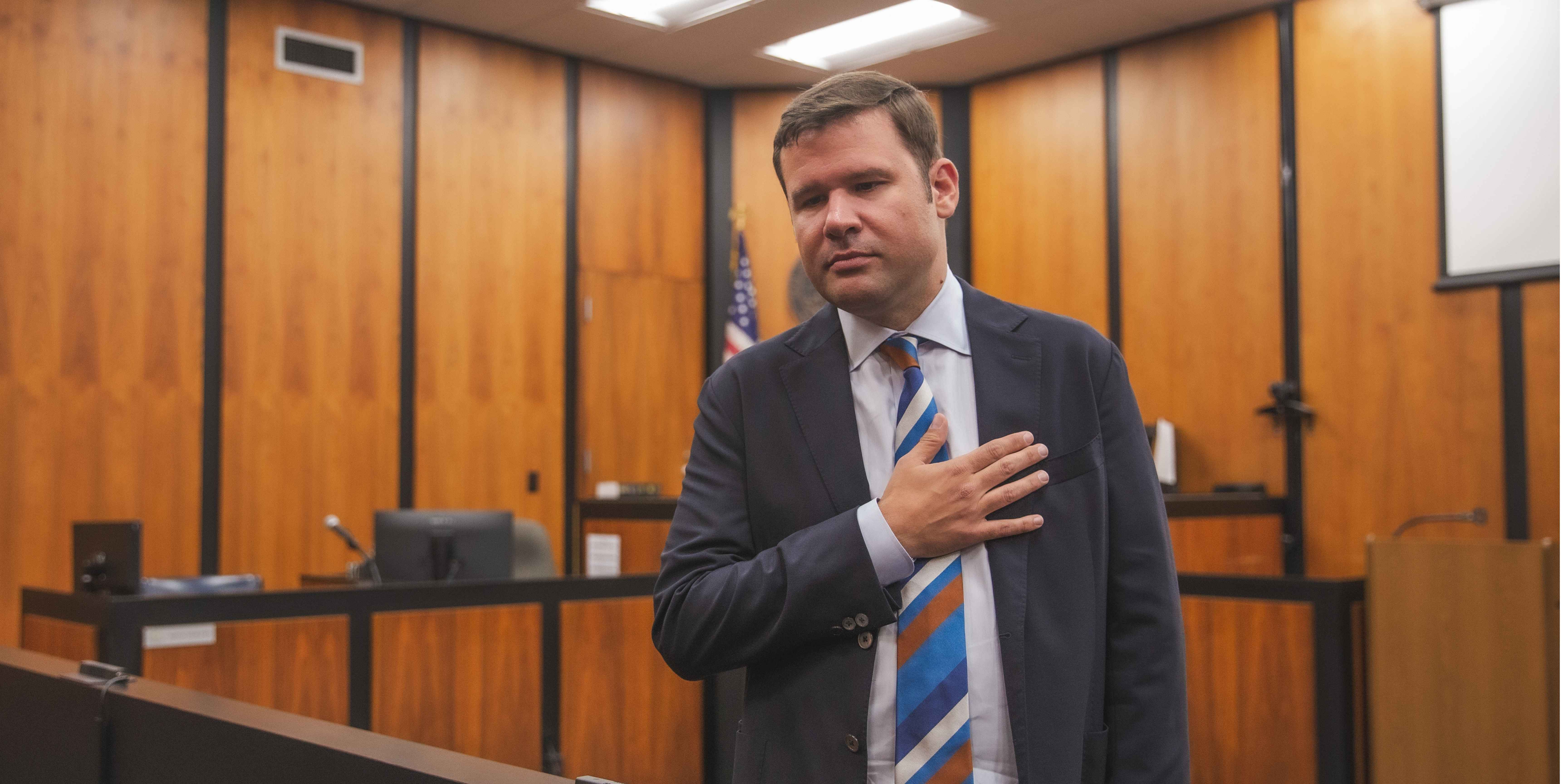 Jones in courtroom hand on heart banner Oct 2025